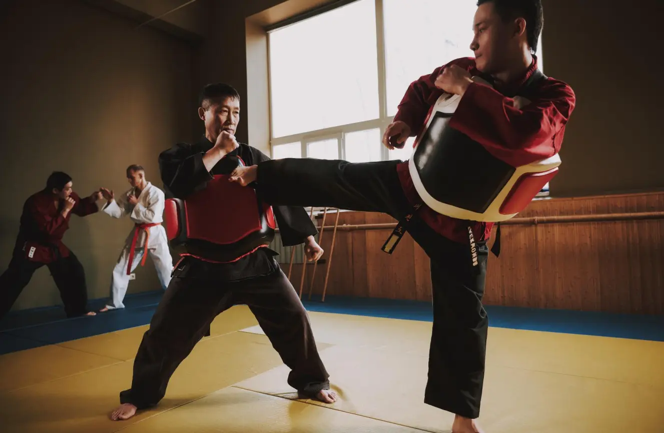 Martial arts classes in a traditional style teach self-defense skills, develop physical strength, and enhance mental benefits like self-discipline and self-esteem, all within a supportive environment that fosters physical development, better heart health, and a strong sense of community.